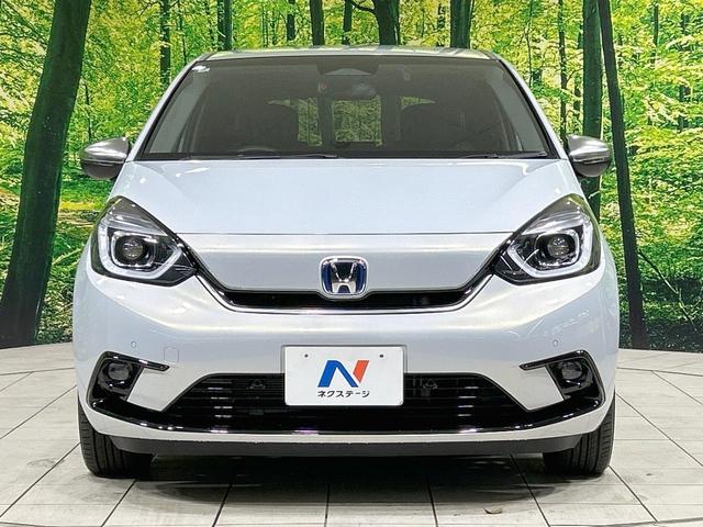 フィット e:HEVリュクス 純正9型ナビ バックカメラ ホンダセンシング 禁煙車 ハーフレザーシート 前席シートヒーター LEDヘッド&フォグ 純正16インチAW ステアリングヒーター コーナーセンサー ETC 置くだけ充電(14枚目)