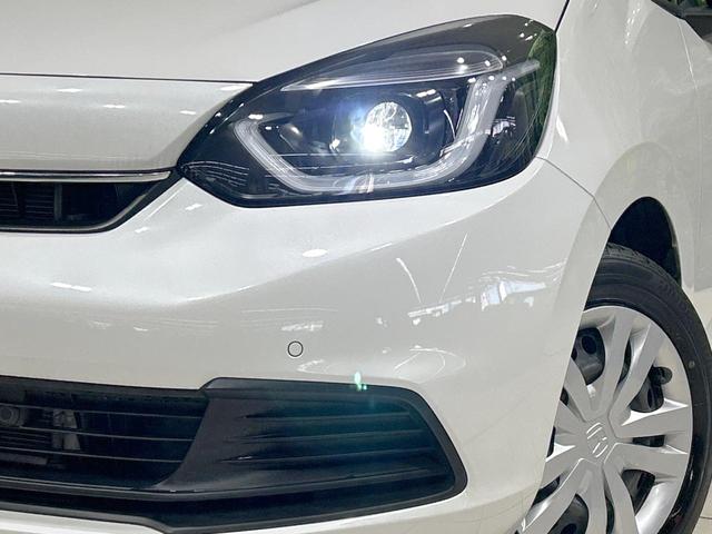 フィット e:HEVホーム バックカメラ ホンダセンシング アダプティブクルーズ 禁煙車 コーナーセンサー ハーフレザーシート ETC オートハイビーム 誤発進抑制機能 先行車発進告知機能 電動格納ミラー パワーウィンドウ(12枚目)