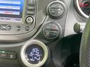 フィット X 純正ナビ バックカメラ クルーズコントロール 禁煙車 HIDヘッド ETC オートライト オートエアコン 純正15インチAW CD/DVD再生 地デジ ドアバイザー 電動格納ミラー 革巻きステアリング(7枚目)