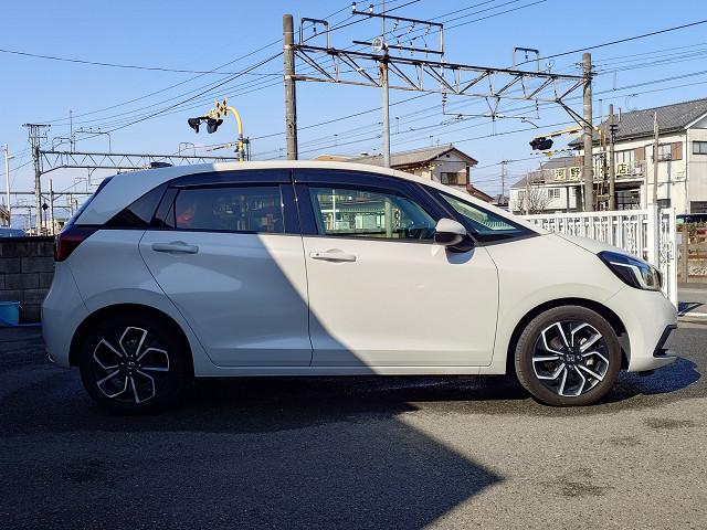 フィット e:HEVホーム 純正9型ナビTV バックカメラ ホンダセンシング 衝突軽減 レーダークルーズ レーンキープ ハーフレザーシート LEDヘッド 前後コーナーセンサー スマートキー 純正アルミ 純正前後ドラレコ 禁煙車(7枚目)