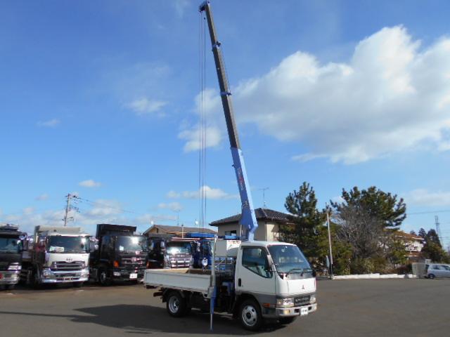 キャンター 　クレーン付き平ボディ　上物タダノ製　４段ブーム　ラジコン（無線）　フックイン　セミロングボディ　荷台寸法２９１ｘ１７９ｘ３７　荷台床木張り　走行１０．９万ｋｍ　５速ミッション（18枚目）