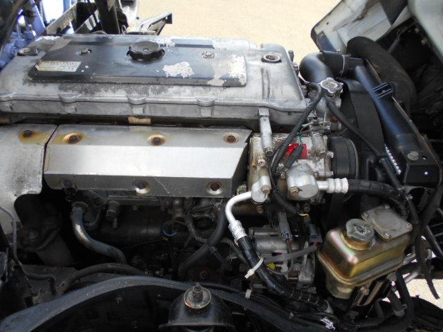 キャンター 　クレーン付き平ボディ　上物タダノ製　４段ブーム　ラジコン（無線）　フックイン　セミロングボディ　荷台寸法２９１ｘ１７９ｘ３７　荷台床木張り　走行１０．９万ｋｍ　５速ミッション（50枚目）