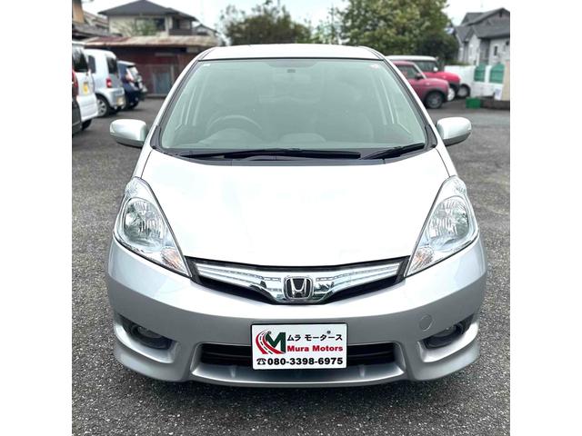 フィットシャトルハイブリッド ハイブリッド ファインライン ETC バックカメラ ナビ TV オートクルーズコントロール 電動格納ミラー CVT 盗難防止システム 衝突安全ボディ アルミホイール CD DVD再生 USB ABS ESC エアコン(2枚目)