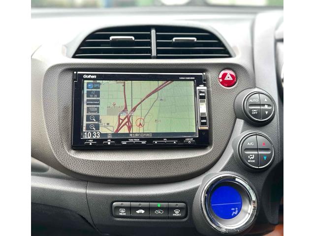 フィットシャトルハイブリッド ハイブリッド ファインライン ETC バックカメラ ナビ TV オートクルーズコントロール 電動格納ミラー CVT 盗難防止システム 衝突安全ボディ アルミホイール CD DVD再生 USB ABS ESC エアコン(25枚目)