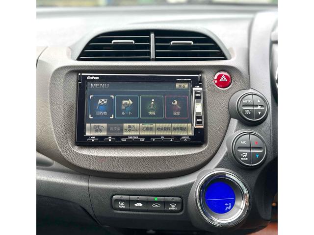 フィットシャトルハイブリッド ハイブリッド ファインライン ETC バックカメラ ナビ TV オートクルーズコントロール 電動格納ミラー CVT 盗難防止システム 衝突安全ボディ アルミホイール CD DVD再生 USB ABS ESC エアコン(26枚目)