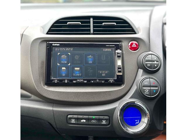 フィットシャトルハイブリッド ハイブリッド ファインライン ETC バックカメラ ナビ TV オートクルーズコントロール 電動格納ミラー CVT 盗難防止システム 衝突安全ボディ アルミホイール CD DVD再生 USB ABS ESC エアコン(27枚目)