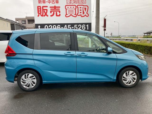 フリード G・ホンダセンシング 純正9インチナビ フリップダウンモニター Cパッケージ LEDヘッドランプ ナビ装着用SP バックモニター 両側パワースライドドア ホンダセンシング コンフォートパッケージ 2列目ベンチシート 禁煙車(5枚目)