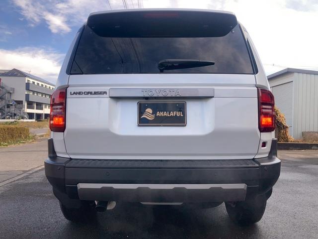 ランドクルーザー２５０ ＶＸ　１２．３型ディスプレイナビ　ムーンルーフ　ルーフレール　セーフティセンス　レザーシート　リフレクター式３眼ＬＥＤヘッドランプ　デジタルインナーミラー　全方位モニター　パワーバックドア　ＢＳＭ　地デジ（9枚目）