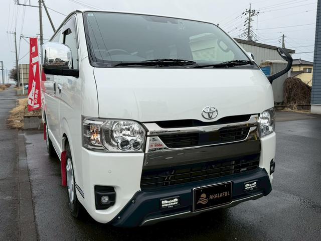 ハイエースバン スーパーＧＬ　ダークプライムＩＩ　純正ナビ　両側パワースライドドア　パノラミックビューモニター　セーフティセンス　ＴＲＤフロントスポイラー　ＴＲＤマッドフラップ　ＡＣ１００Ｖ電源　ＴＶ　プッシュスタート　リアヒータークーラー　禁煙車（3枚目）