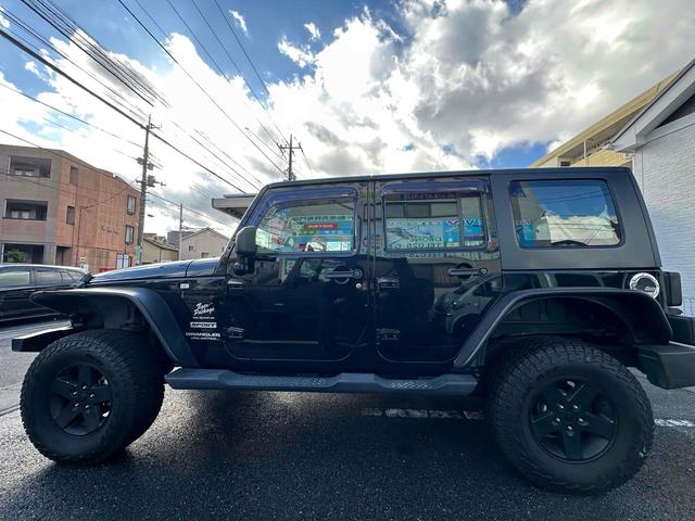 ジープ・ラングラーアンリミテッド スポーツ 4WD リフトアップ 社外オバーフェンダー ドライブレコーダー ETC バックカメラ フロントカメラ オートクルーズ ナビ アルミホイール キーレスエントリー AT 盗難防止システム CD DVD再生(23枚目)