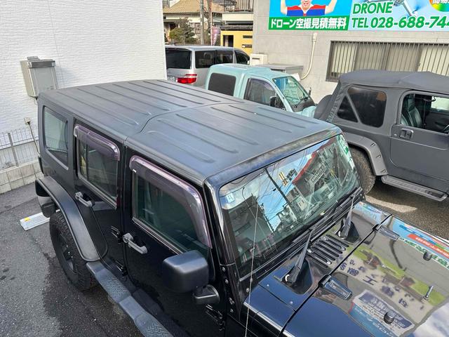 ジープ・ラングラーアンリミテッド スポーツ 4WD リフトアップ 社外オバーフェンダー ドライブレコーダー ETC バックカメラ フロントカメラ オートクルーズ ナビ アルミホイール キーレスエントリー AT 盗難防止システム CD DVD再生(36枚目)