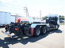 クオン アームロール ハイルーフ 2デフ 積載11.7t GVW25t エスコット 新明和 CCA1414-30 ツインホイスト キャブバックステップ 8.5mモード切替付 リアローラージャッキ タコグラフ 取説、記録簿有(4枚目)