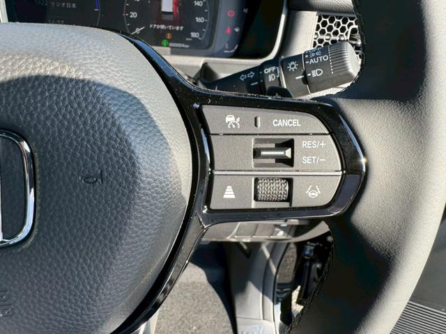 ステップワゴン ｅ：ＨＥＶスパーダ　登録済み未使用車　メーカーＯＰデカナビ　アラウンドビュー　フリップダウンモニター　電動リアゲート　シートヒーター　ハーフレザーシート　レーダークルコン　両側自動スライド　コーナーセンサー　オットマン（30枚目）