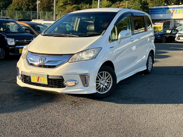 フリードハイブリッド ジャストセレクション 禁煙車 フリップダウンモニター 社外7型ナビ ドラレコ前後 ETC リア両側電動スライドドア ハーフレザーシート スマートキー オートライト 電格ミラー 革ステアリング ステリモ クルコン TRC(12枚目)