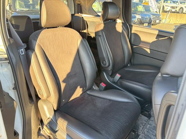 フリードハイブリッド ジャストセレクション 禁煙車 フリップダウンモニター 社外7型ナビ ドラレコ前後 ETC リア両側電動スライドドア ハーフレザーシート スマートキー オートライト 電格ミラー 革ステアリング ステリモ クルコン TRC(18枚目)