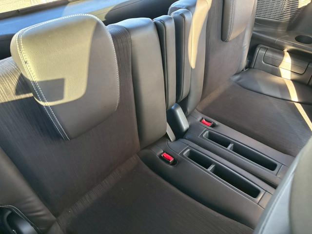 フリードハイブリッド ジャストセレクション 禁煙車 フリップダウンモニター 社外7型ナビ ドラレコ前後 ETC リア両側電動スライドドア ハーフレザーシート スマートキー オートライト 電格ミラー 革ステアリング ステリモ クルコン TRC(24枚目)