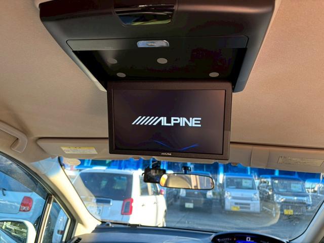 フリードハイブリッド ジャストセレクション 禁煙車 フリップダウンモニター 社外7型ナビ ドラレコ前後 ETC リア両側電動スライドドア ハーフレザーシート スマートキー オートライト 電格ミラー 革ステアリング ステリモ クルコン TRC(38枚目)