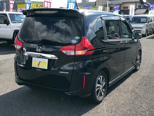 フリードハイブリッド ハイブリッド・Ｇホンダセンシング　Ｓパッケージ　モデューロエアロ　禁煙車　純正９型ナビ　ブルートゥース　バックカメラ　ドラレコ前後　ＥＴＣ　レーダークルコン　後席サンシェード　リア両側電動スライドドア　スマートキー　レーンキープ　ＰＷ（4枚目）