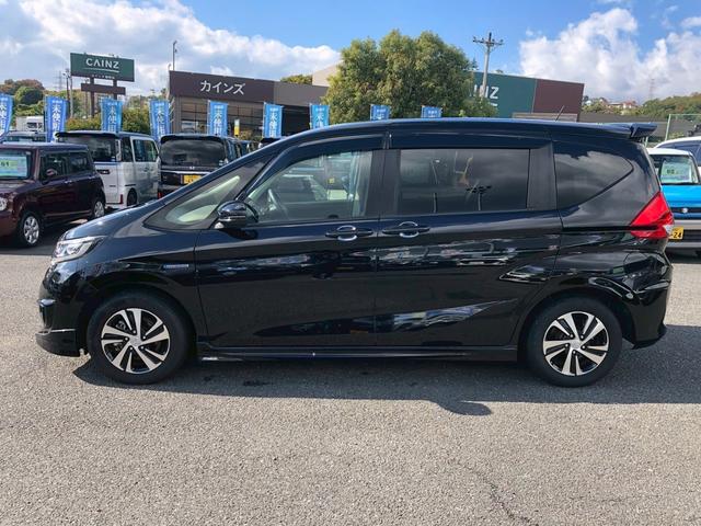 フリードハイブリッド ハイブリッド・Ｇホンダセンシング　Ｓパッケージ　モデューロエアロ　禁煙車　純正９型ナビ　ブルートゥース　バックカメラ　ドラレコ前後　ＥＴＣ　レーダークルコン　後席サンシェード　リア両側電動スライドドア　スマートキー　レーンキープ　ＰＷ（11枚目）