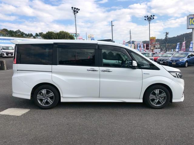 ステップワゴンスパーダ スパーダハイブリッド　Ｇ　ホンダセンシング　衝突軽減ブレーキ　禁煙車　フリップダウンモニター　純正８型ナビ　ＤＶＤ　ブルートゥース　ＴＶ　バックカメラ　ＥＴＣ　両側電動スライドドア　ＬＥＤオートライト　レーダークルーズコントロール　後席サンシェード　車線逸脱警告（8枚目）