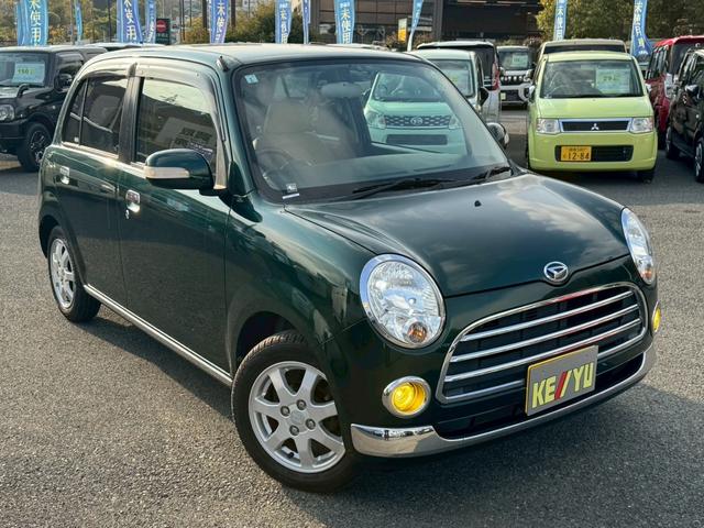 ミラジーノ プレミアムX 禁煙 革調シートカバー 7型ナビ バックカメラ ブルートゥース DVD CD MOMOウッドハンドル ETC HID フォグランプ ウインカー付き電格ミラー オートライト キーレス ヘットライトレベライザー Wエアバック ウインカー付き電格ミラー(4枚目)