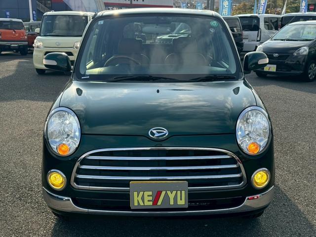 ミラジーノ プレミアムX 禁煙 革調シートカバー 7型ナビ バックカメラ ブルートゥース DVD CD MOMOウッドハンドル ETC HID フォグランプ ウインカー付き電格ミラー オートライト キーレス ヘットライトレベライザー Wエアバック ウインカー付き電格ミラー(5枚目)