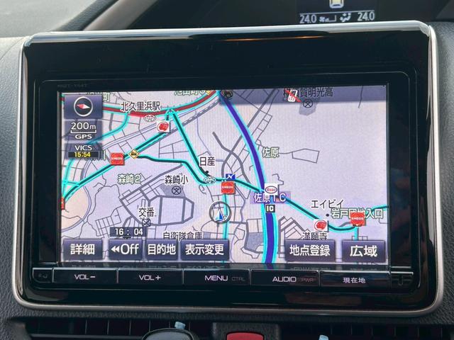 ヴォクシー ZS 煌 (弊社下取り車/禁煙車)トヨタ純正9インチナビ Bluetooth接続/ミュージックサーバー/両側自動スライドドア/レーンアシスト/衝突被害軽減システム/フリップダウンモニター/トヨタ純正アルミホイール/3列シート/ウォークスルー/Rスポイラー(34枚目)