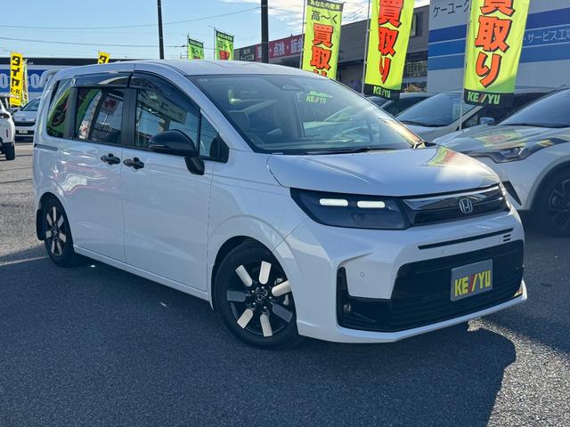 フリード ｅ：ＨＥＶエアー　ＥＸ　９インチナビ　エアロバンパー　フルセグ　Ｂｌｕｅｔｏｏｔｈ　ＥＴＣ　ワンオーナー　両側電動スライド　リヤスポイラー　ハーフレザー　シートヒーター　禁煙　ローダウン　ＢＳＭ　レーダークルーズ（4枚目）