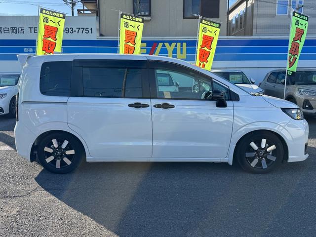 フリード ｅ：ＨＥＶエアー　ＥＸ　９インチナビ　エアロバンパー　フルセグ　Ｂｌｕｅｔｏｏｔｈ　ＥＴＣ　ワンオーナー　両側電動スライド　リヤスポイラー　ハーフレザー　シートヒーター　禁煙　ローダウン　ＢＳＭ　レーダークルーズ（5枚目）