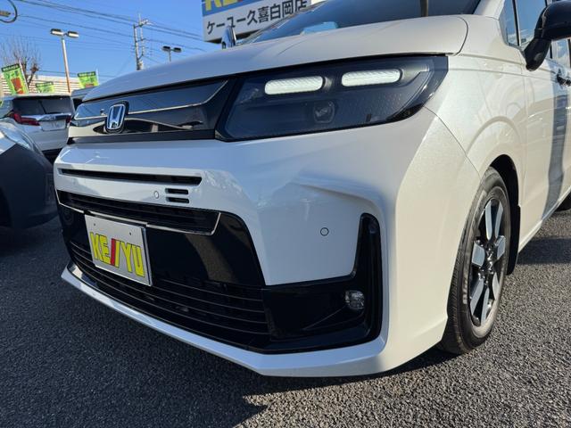 フリード ｅ：ＨＥＶエアー　ＥＸ　９インチナビ　エアロバンパー　フルセグ　Ｂｌｕｅｔｏｏｔｈ　ＥＴＣ　ワンオーナー　両側電動スライド　リヤスポイラー　ハーフレザー　シートヒーター　禁煙　ローダウン　ＢＳＭ　レーダークルーズ（40枚目）