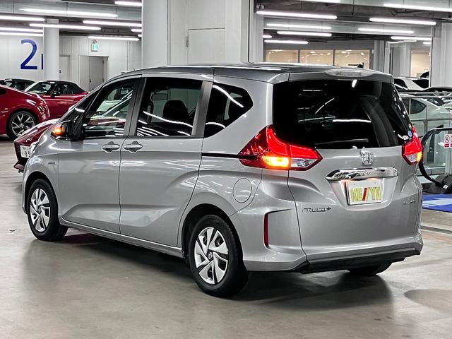 フリード+ハイブリッド ハイブリッドG・ホンダセンシング ワンオーナー 衝突軽減ブレーキ 車線逸脱警報 アダプティブクルーズ ETC 両側パワースライド 純正ディスプレイオーディオ バックカメラ CD再生 TV USB端子 オートエアコン 電動格納ドアミラー LEDランプ(8枚目)