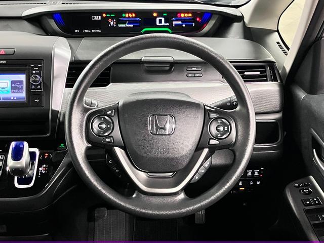 フリード+ハイブリッド ハイブリッドG・ホンダセンシング ワンオーナー 衝突軽減ブレーキ 車線逸脱警報 アダプティブクルーズ ETC 両側パワースライド 純正ディスプレイオーディオ バックカメラ CD再生 TV USB端子 オートエアコン 電動格納ドアミラー LEDランプ(11枚目)