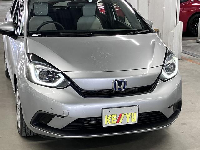 フィット ｅ：ＨＥＶベーシック　ホンダセンシング　ワンオーナー　純正９インチナビ　バックカメラ　ＢＴオーディオ　フルセグＴＶ　ＣＤ・ＤＶＤ　ＥＴＣ　誤発進抑制機能　アダプティブクルーズ　パーキングセンサー　ブレーキホールド　ＬＥＤライト　スマートキー　スペアキー有（51枚目）