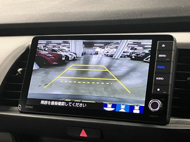 フィット ｅ：ＨＥＶベーシック　ホンダセンシング　ワンオーナー　純正９インチナビ　バックカメラ　ＢＴオーディオ　フルセグＴＶ　ＣＤ・ＤＶＤ　ＥＴＣ　誤発進抑制機能　アダプティブクルーズ　パーキングセンサー　オートブレーキホールド　ＬＥＤライト　スマートキー　記録簿（16枚目）