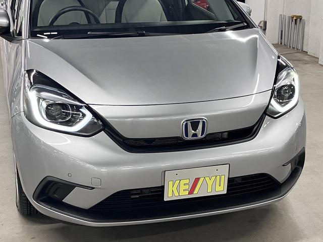 フィット ｅ：ＨＥＶベーシック　ホンダセンシング　ワンオーナー　純正９インチナビ　バックカメラ　ＢＴオーディオ　フルセグＴＶ　ＣＤ・ＤＶＤ　ＥＴＣ　誤発進抑制機能　アダプティブクルーズ　パーキングセンサー　オートブレーキホールド　ＬＥＤライト　スマートキー　記録簿（50枚目）