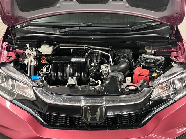 フィットハイブリッド S ホンダセンシング 寒冷地仕様 無限マフラー 衝突軽減ブレーキ 車線逸脱警報 アダプティブクルーズ パドルシフト ETC 純正ナビ バックカメラ BTオーディオ フルセグ スマートキー オートリトラミラー LEDランプ(21枚目)