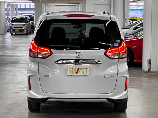 フリードハイブリッド ハイブリッド・クロスターホンダセンシング 衝突軽減ブレーキ 車線逸脱警報 アダプティブクルーズ ETC 純正9インチナビ 両側パワースライド バックカメラ BTオーディオ フルセグTV USB スマートキー オートリトラミラー LEDランプ(7枚目)