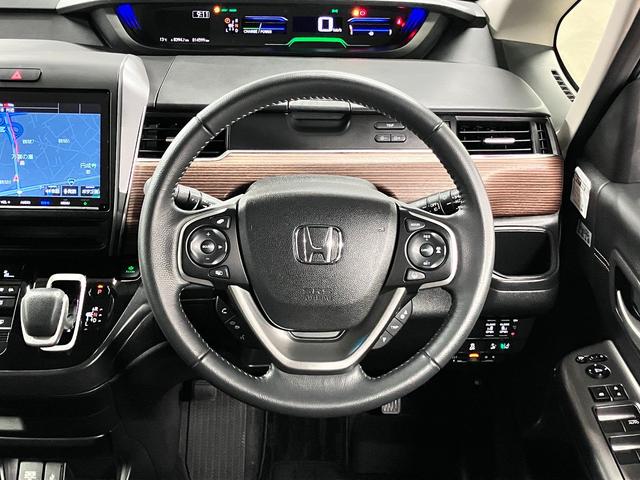 フリードハイブリッド ハイブリッド・クロスターホンダセンシング 衝突軽減ブレーキ 車線逸脱警報 アダプティブクルーズ ETC 純正9インチナビ 両側パワースライド バックカメラ BTオーディオ フルセグTV USB スマートキー オートリトラミラー LEDランプ(11枚目)