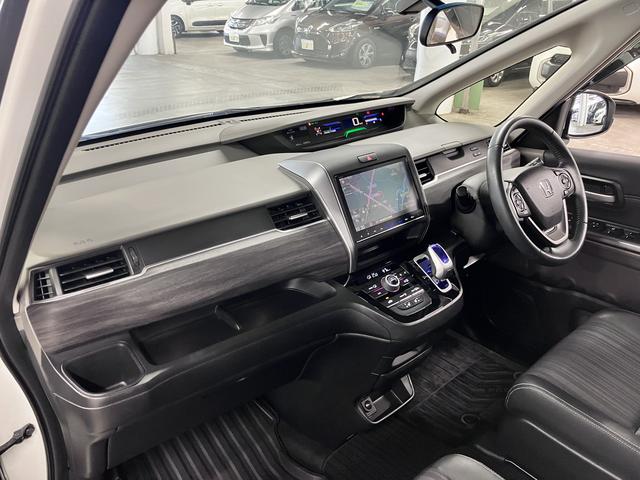 フリードハイブリッド ハイブリッド・EX ホンダセンシング 純正9インチナビ 両側電動スライド シートヒーター コンビシート バックカメラ BTオーディオ フルセグTV CD・DVD ETC コンフォートビューPKG LEDライト 純正15AW スペアキー有(24枚目)