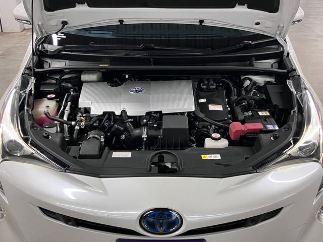 プリウス Ａプレミアム　ツーリングセレクション　パークアシスト　ＨＵＤ　ＢＳＭ　純正９インチナビ　本革電動シート　シートヒーター　セーフティセンスＰ　ＥＴＣ　バックカメラ　ＢＴオーディオ　フルセグＴＶ　ＡＣ１００Ｖ　クリアランスソナー　ＬＥＤランプ（21枚目）