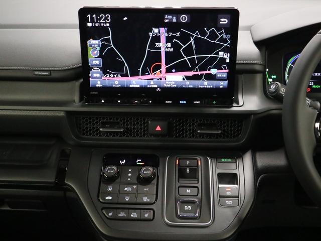 ステップワゴン e:HEVスパーダ 登録済未使用車 ホンダセンシング 15.6インチリヤモニター 11.4インチナビ マルチビューカメラ 後退出庫サポート・BSI シートヒーター オットマン コンビシート パワーバックドア 両側電動スライドドア 全列USB LEDライト(31枚目)