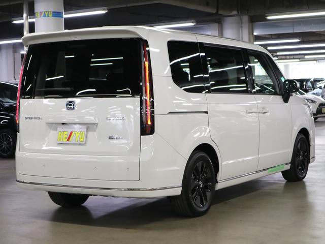 ステップワゴン e:HEVスパーダ 登録済未使用車 ホンダセンシング 15.6インチリヤモニター 11.4インチナビ マルチビューカメラ 後退出庫サポート・BSI シートヒーター オットマン コンビシート パワーバックドア 両側電動スライドドア 全列USB LEDライト(3枚目)