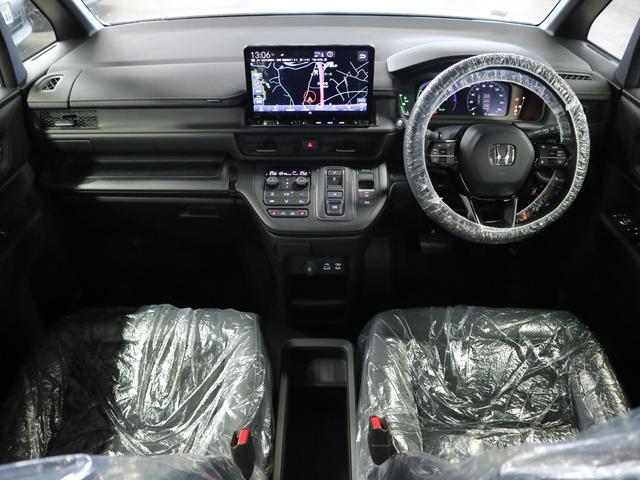 ステップワゴン e:HEVスパーダ 登録済未使用車 ホンダセンシング 15.6インチリヤモニター 11.4インチナビ マルチビューカメラ 後退出庫サポート・BSI シートヒーター オットマン コンビシート パワーバックドア 両側電動スライドドア 全列USB LEDライト(4枚目)
