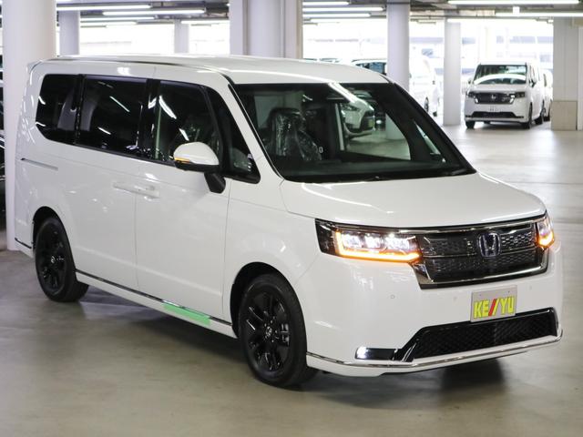 ステップワゴン e:HEVスパーダ 登録済未使用車 ホンダセンシング 15.6インチリヤモニター 11.4インチナビ マルチビューカメラ 後退出庫サポート・BSI シートヒーター オットマン コンビシート パワーバックドア 両側電動スライドドア 全列USB LEDライト(5枚目)