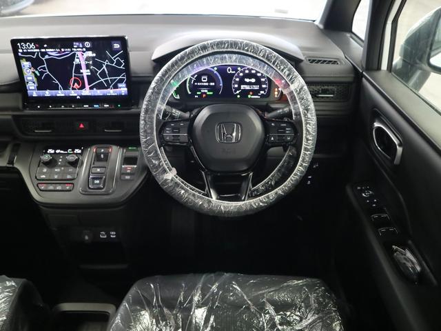 ステップワゴン e:HEVスパーダ 登録済未使用車 ホンダセンシング 15.6インチリヤモニター 11.4インチナビ マルチビューカメラ 後退出庫サポート・BSI シートヒーター オットマン コンビシート パワーバックドア 両側電動スライドドア 全列USB LEDライト(11枚目)