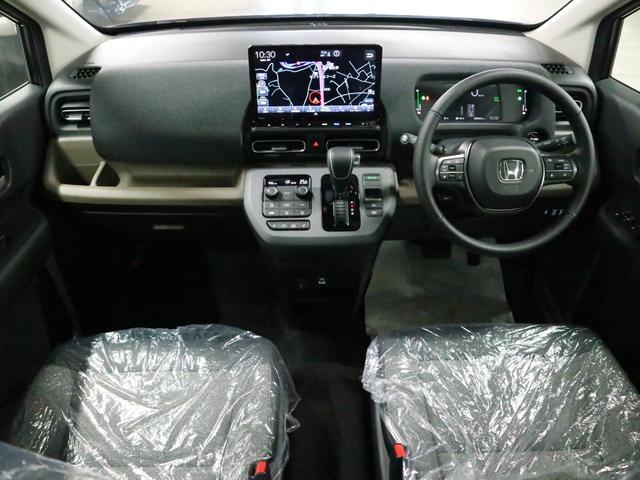 フリード e:HEVエアー EX 登録済み未使用車 マルチビューカメラ 純正11.4インチナビ ETC2.0 BSI・後退出庫サポート アダプティブドライビングビーム 両側電動スライドドア シートヒーター レザー調コンビシート リアクーラー パーキングセンサー 専用アルミ(3枚目)