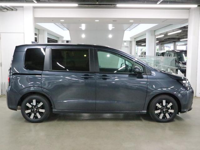 フリード e:HEVエアー EX 登録済み未使用車 マルチビューカメラ 純正11.4インチナビ ETC2.0 BSI・後退出庫サポート アダプティブドライビングビーム 両側電動スライドドア シートヒーター レザー調コンビシート リアクーラー パーキングセンサー 専用アルミ(14枚目)