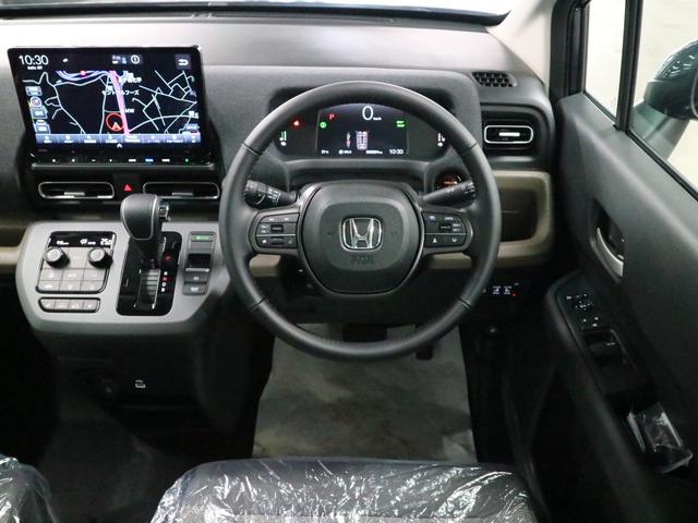 フリード e:HEVエアー EX 登録済み未使用車 マルチビューカメラ 純正11.4インチナビ ETC2.0 BSI・後退出庫サポート アダプティブドライビングビーム 両側電動スライドドア シートヒーター レザー調コンビシート リアクーラー パーキングセンサー 専用アルミ(16枚目)