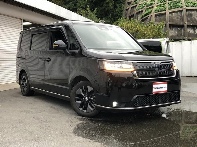 ステップワゴン ｅ：ＨＥＶスパーダ　ホンダセンシング　９インチナビ　ＢＴ・ＵＳＢ・カープレイ接続　マルチビューカメラ　フリップダウンモニター　デジタルミラー　前後ドラレコ　電動ゲート　１タッチＷパワスラ　ヒーター付半革シート　オットマン（5枚目）