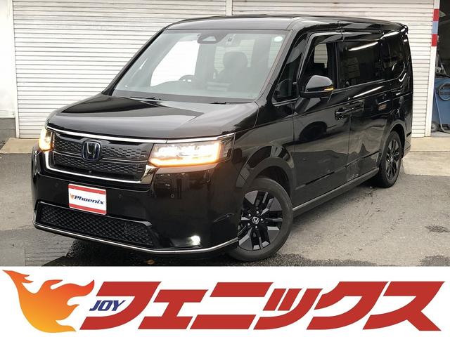ステップワゴン ｅ：ＨＥＶスパーダ　ホンダセンシング　９インチナビ　ＢＴ・ＵＳＢ・カープレイ接続　マルチビューカメラ　フリップダウンモニター　デジタルミラー　前後ドラレコ　電動ゲート　１タッチＷパワスラ　ヒーター付半革シート　オットマン（48枚目）